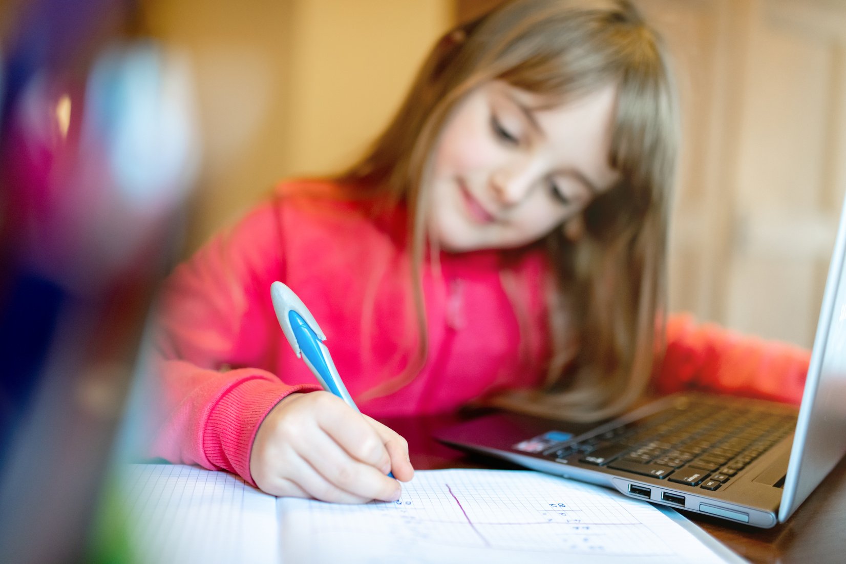 8 years old child girl studying from home